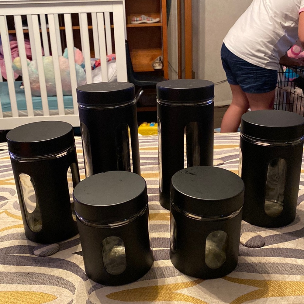 6 canisters,glass  with black,screw on tops